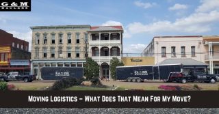 Two G&M Haulers moving trucks are parked in front of historic downtown buildings with a banner reading, Moving Logistics – What Does That Mean For My Move?.